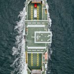 Aerial view of a vessel's deck navigating at sea