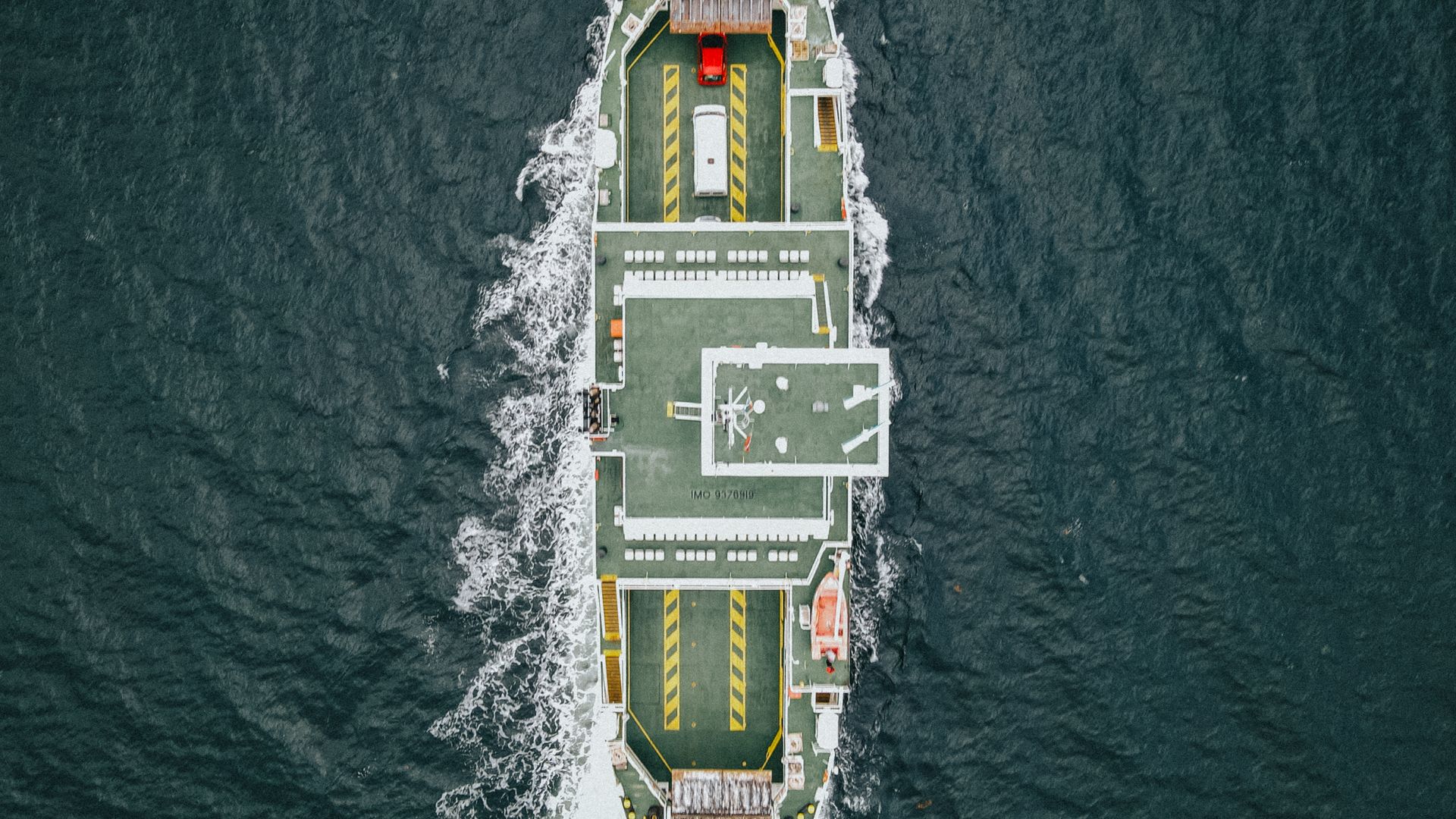 Aerial view of a vessel's deck navigating at sea, supporting Antarctic logistics operations